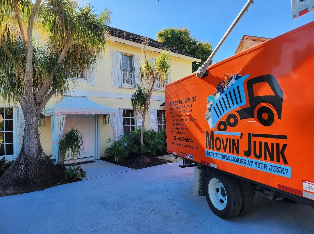 Movin' Junk truck at residential pickup